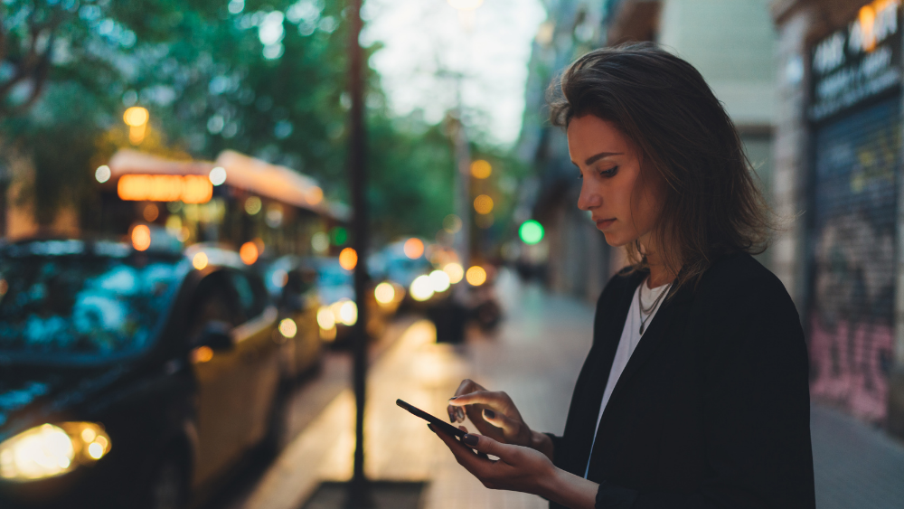 Woman texting on cell phone